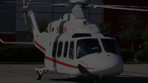 White helicopter on tarmac
